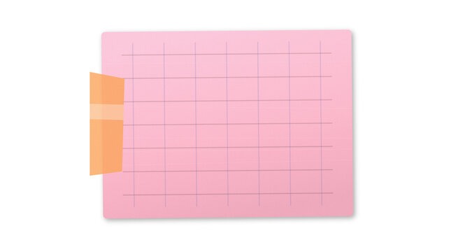Pink grid sticky note with horizontal lines taped to a transparent background.