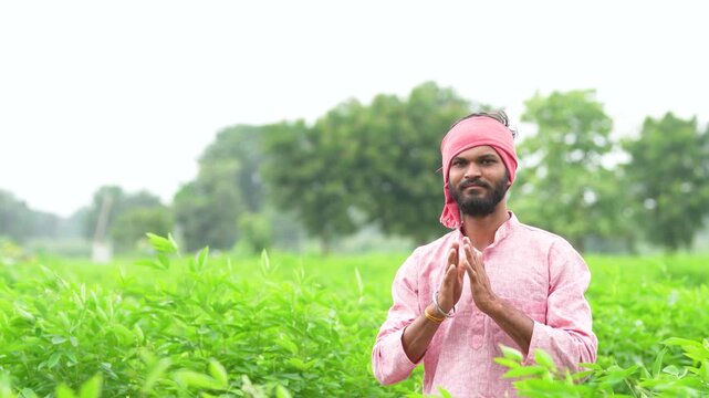 Indian farmer standing and doing namaste at pigeon pea agriculture field