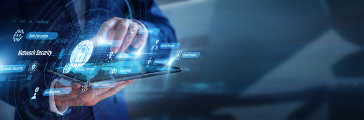 Cyber defense admin working on tablet configuring safe Network Security firewalls. Professional analyzing encrypted digital server data and hacker threat protocols on a smart hologram screen. © CyberFrame