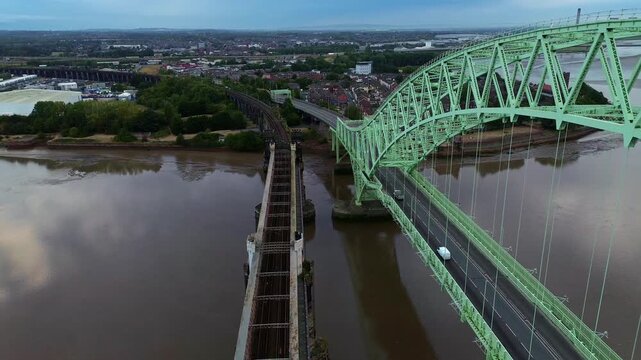 Silver Jubilee bridge aerial view as cars drive across the town connection