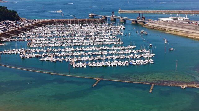 Sailboats docked in Bas Sablons marina in Saint-Malo, France. Aerial drone view