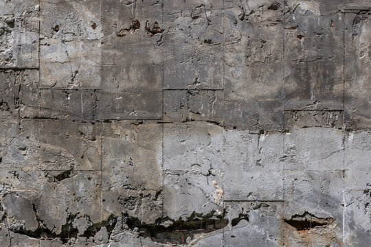 Textured Aged Concrete Wall with Crumbling Surface