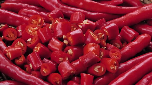 Sliced fresh red chili peppers in a basket	