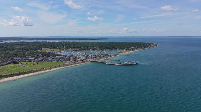 Oak Bluffs waterfront, Ocean Park green lawn, and ferry dock in Massachusetts. Aerial drone panoramic view