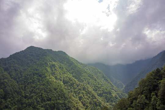 Green Mountain Valley Beneath Dramatic Clouds