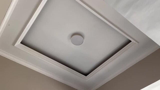 Modern minimalist interior drop ceiling design with hidden lighting