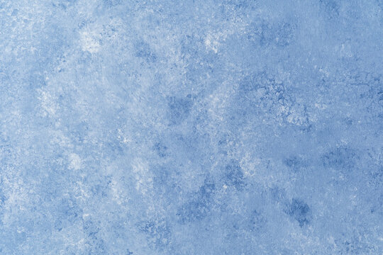 Light blue wall texture with soft mottled pattern and plaster effect