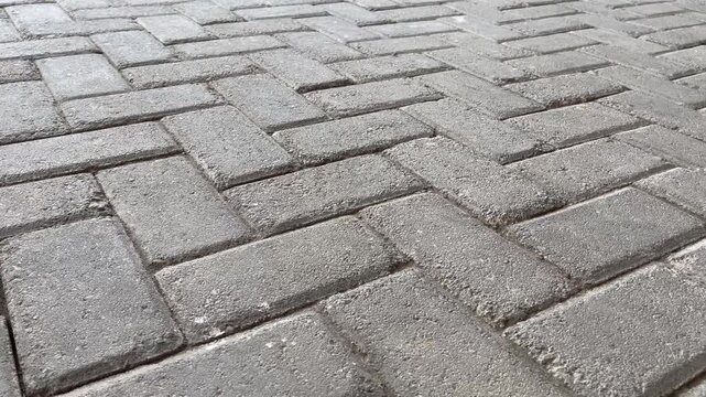Perspective view of concrete paving block walkway texture background