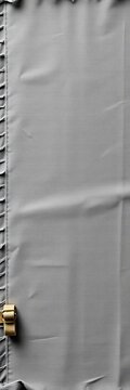Gray cotton fabric with frayed edges and worn straps, weathered, frayed