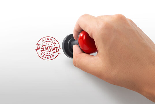 Hand Stamping Red Banned Mark on White Background