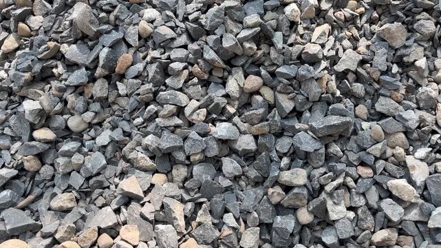 Close up of crushed gravel stones texture for construction background