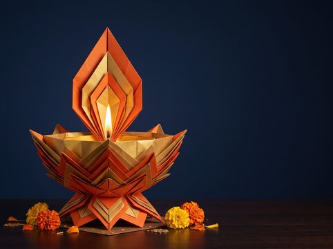 Origami paper diya centerpiece for diwali celebration with marigolds for advertising poster and display design