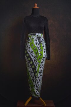 Indonesian Kebaya with Lace Sheer Fabric with Batik Skirt on a Display Mannequin