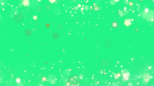 Sparkling star bokeh particles form a decorative glittering frame over a bright green chroma key background.