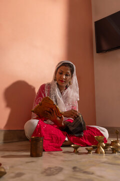 Woman engaged in ritual preparation at home