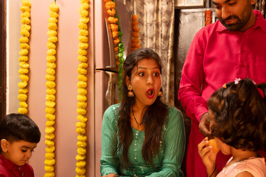 Family reacting joyfully during a festive celebration