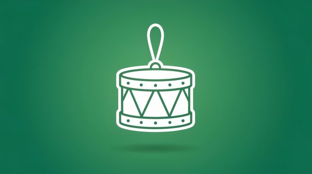 Toy drum Christmas tree ornament hangs isolated against a vibrant green gradient background.
