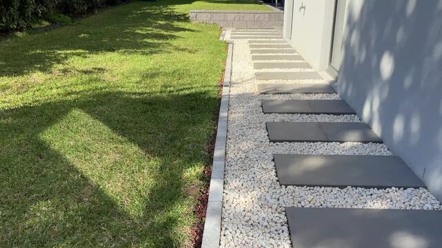 Contemporary Residential Hardscape Walkway With Concrete Pavers and Decorative Gravel
