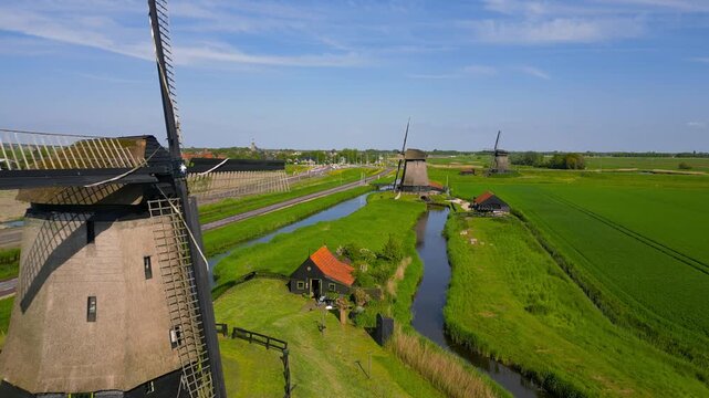 Traditional dutch windmills in the countryside aerial view near Schermerhorn village.