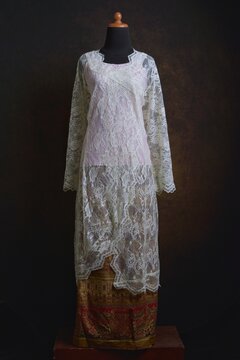 Traditional Kebaya with Sheer Lace Fabric with golden and pink Songket Skirt