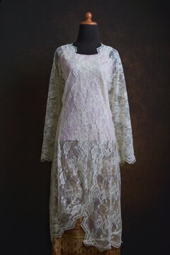Traditional Kebaya with Sheer Lace Fabric with golden and pink Songket Skirt