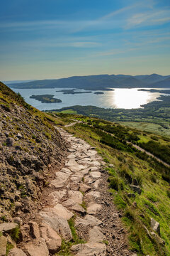 View from Conic Hill near Balmaha onto Loch Lomond in the Loch Lomond and the Trossards National Park, Scotland, in evening light.