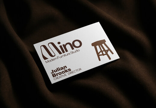 Business Card Mockup PSD On Dark Fabric With Modern Logo And Stool Icon