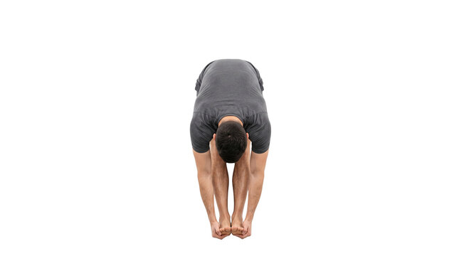 Athletic man performing standing forward fold yoga pose. Flexible male athlete in uttanasana stretch. Fitness training and wellness concept. isolated PNG with Transparent Background