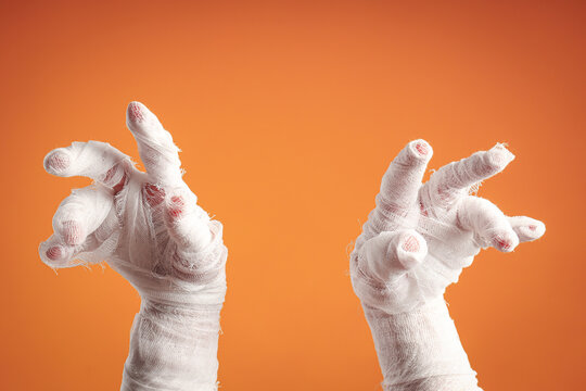 Halloween. Mummy hands stretch out with an eerie vibe perfect for Halloween