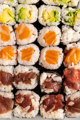 Variety of maki sushi rolls with salmon tuna avocado © Cavan