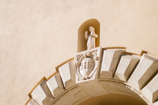 Religious statue of Jesus on a church facade