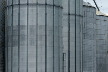 Fototapeta na wymiar Textured metal exterior of industrial grain elevators