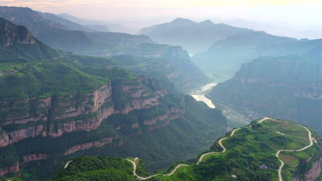 Aerial panorama of magnificent Taihang Mountains grand canyon with steep layered rock cliffs, natural geological landforms in China