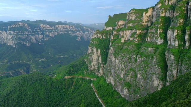 Aerial panorama of magnificent Taihang Mountains grand canyon with steep layered rock cliffs, natural geological landforms in China
