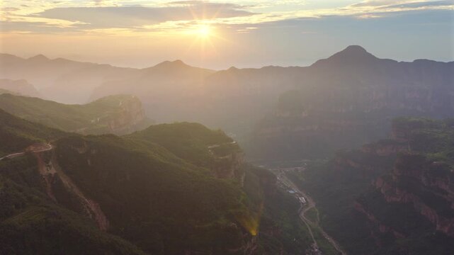 Aerial sunrise over South Taihang grand canyon, spectacular layered cliff landscape at dawn