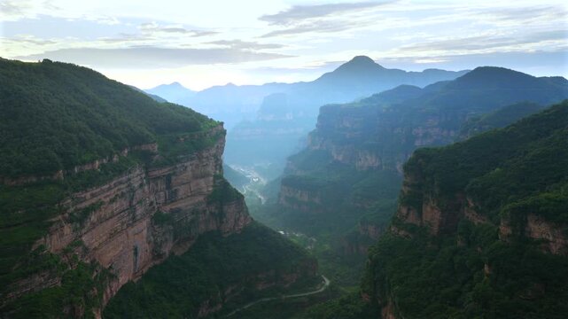 Aerial panorama of magnificent Taihang Mountains grand canyon with steep layered rock cliffs, natural geological landforms in China