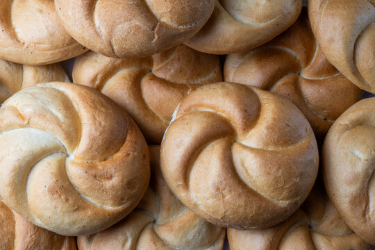 Fresh bread rolls arranged in close up