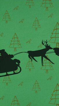 Animated Santa silhouette and reindeers fly over Christmas trees on green.