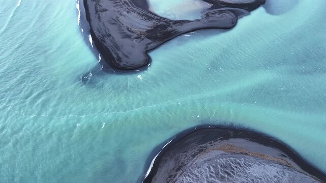Aerial view of a meandering glacial stream, Skjalfandafljot, flowing into Skj&aacute;lfandi Bay in the north of Iceland