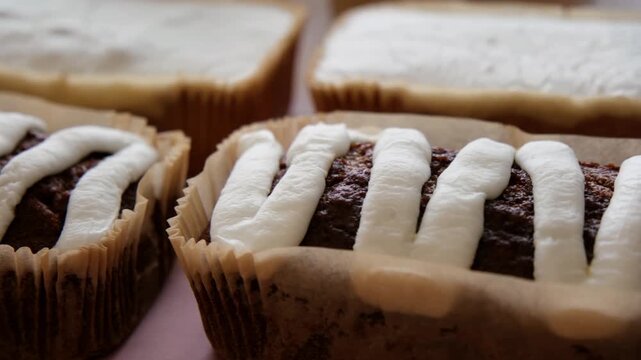 Close Up of Freshly Baked banana bread Filled With white icing on a Bakery Display