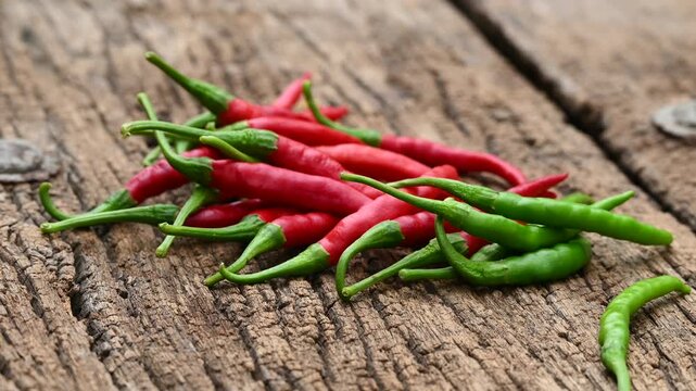 red fresh organic chilli pepper on wooden table background