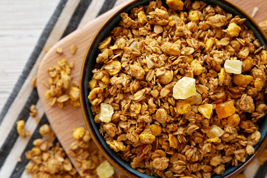 Crispy Granola with Tropical Fruits in a Bowl, top view. Close-up.