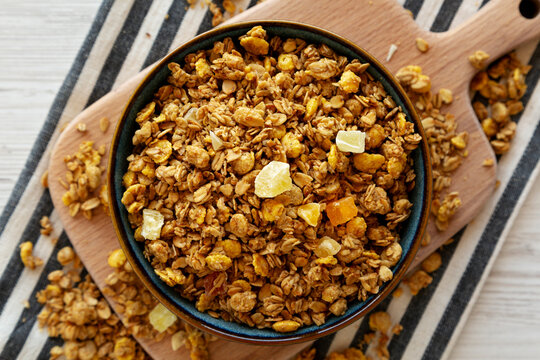 Crispy Granola with Tropical Fruits in a Bowl, top view.