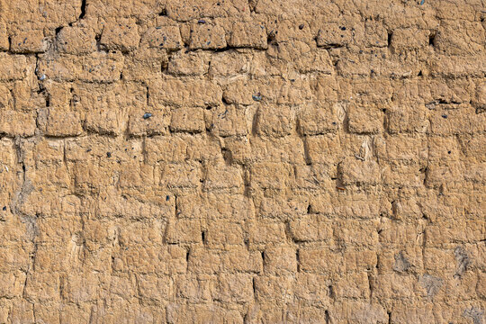 Textured Wall with Rustic Mud Brick Surface