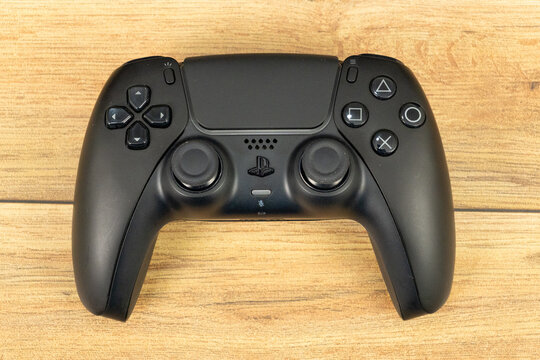 Bogota, Colombia - August 2026 Black ps5 dualsense controller on wooden table