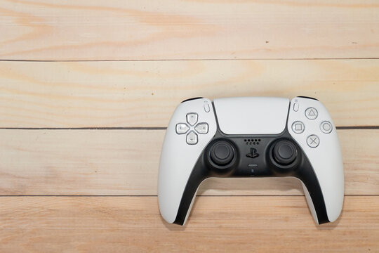 Bogota, Colombia - August 2026 Sony playstation 5 dualsense controller on wood background