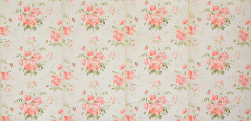 Old wallpaper on the wall. Old wallpaper for texture or background.