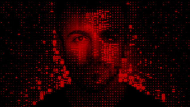 Male Face dissolving into Computer Code, symbolising Surveillance Capitalism Concept.