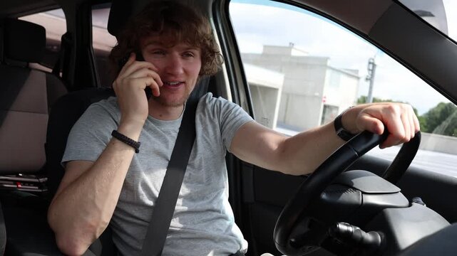 Taxi driver waits in a parked car and calls a customer who does not answer leaving him unsure where the passenger is while the ride remains delayed and cannot begin today