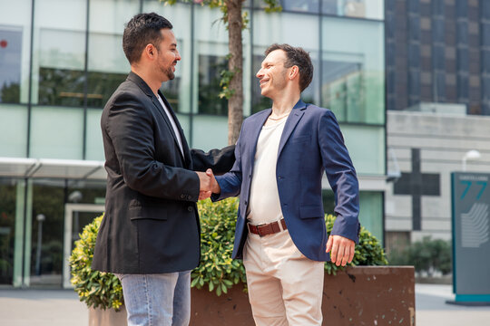 Startup founders shaking hands sealing a business deal